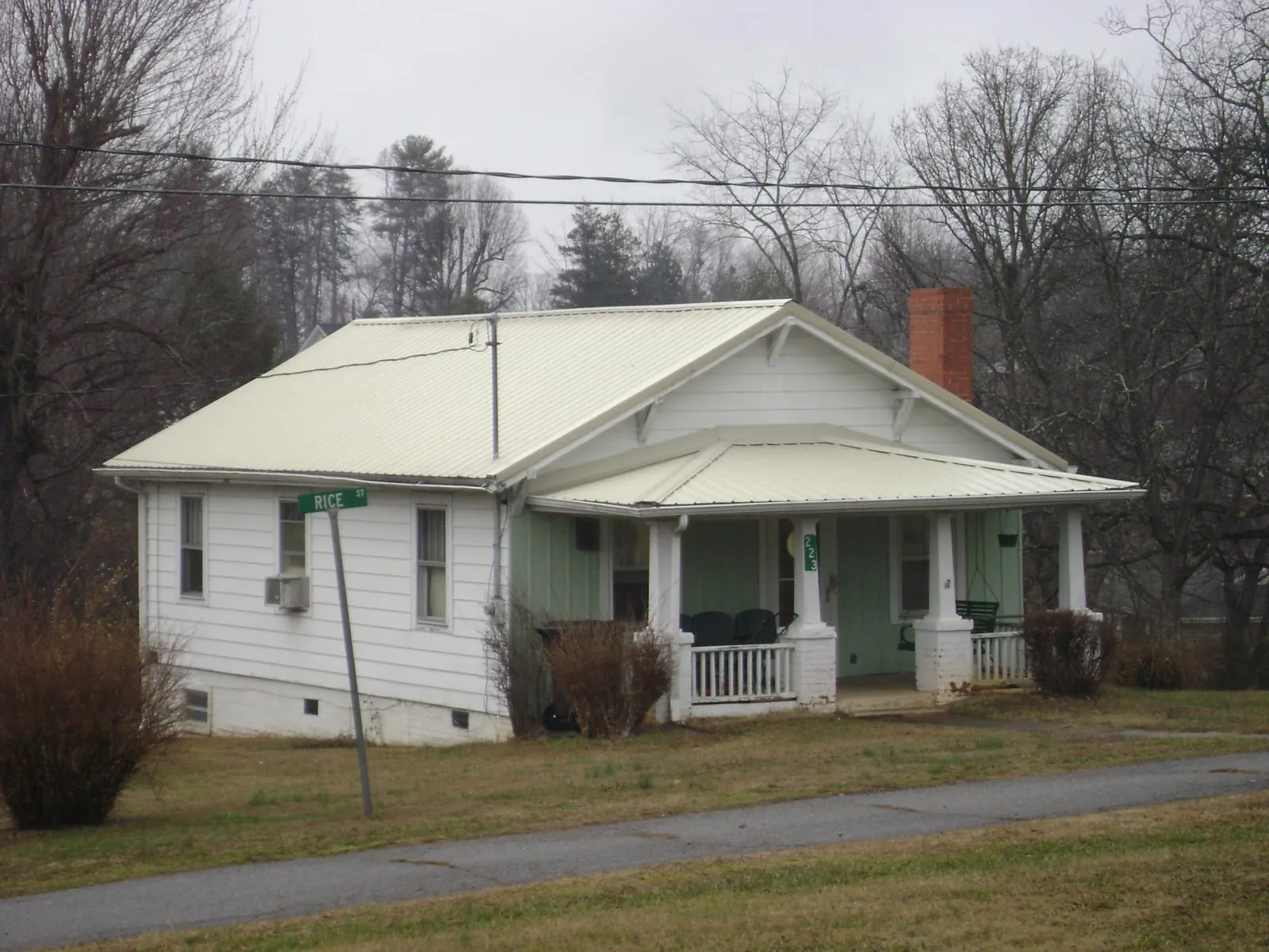 White metal roof on a craftsman bungalow at a street corner in Mount Victory